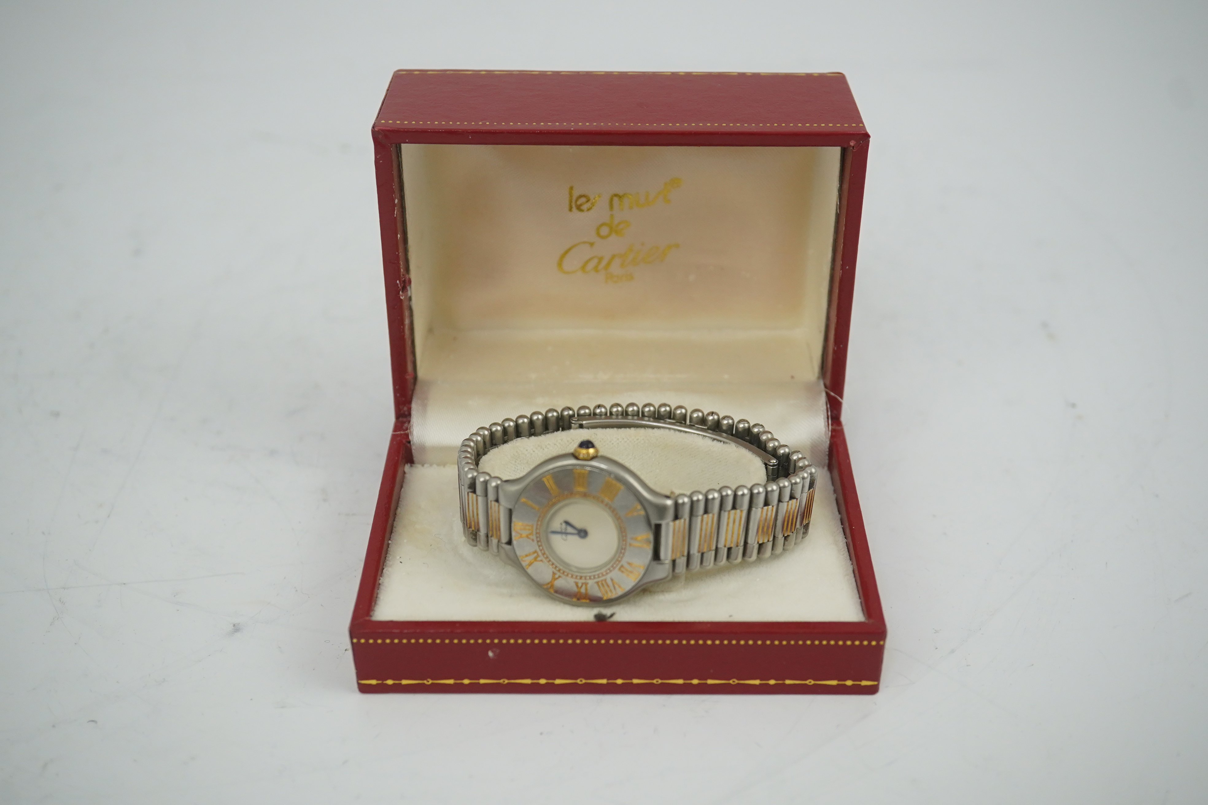 A lady's steel and gold plated Must De Cartier quartz wrist watch, on a steel and gold plated Must De Cartier bracelet